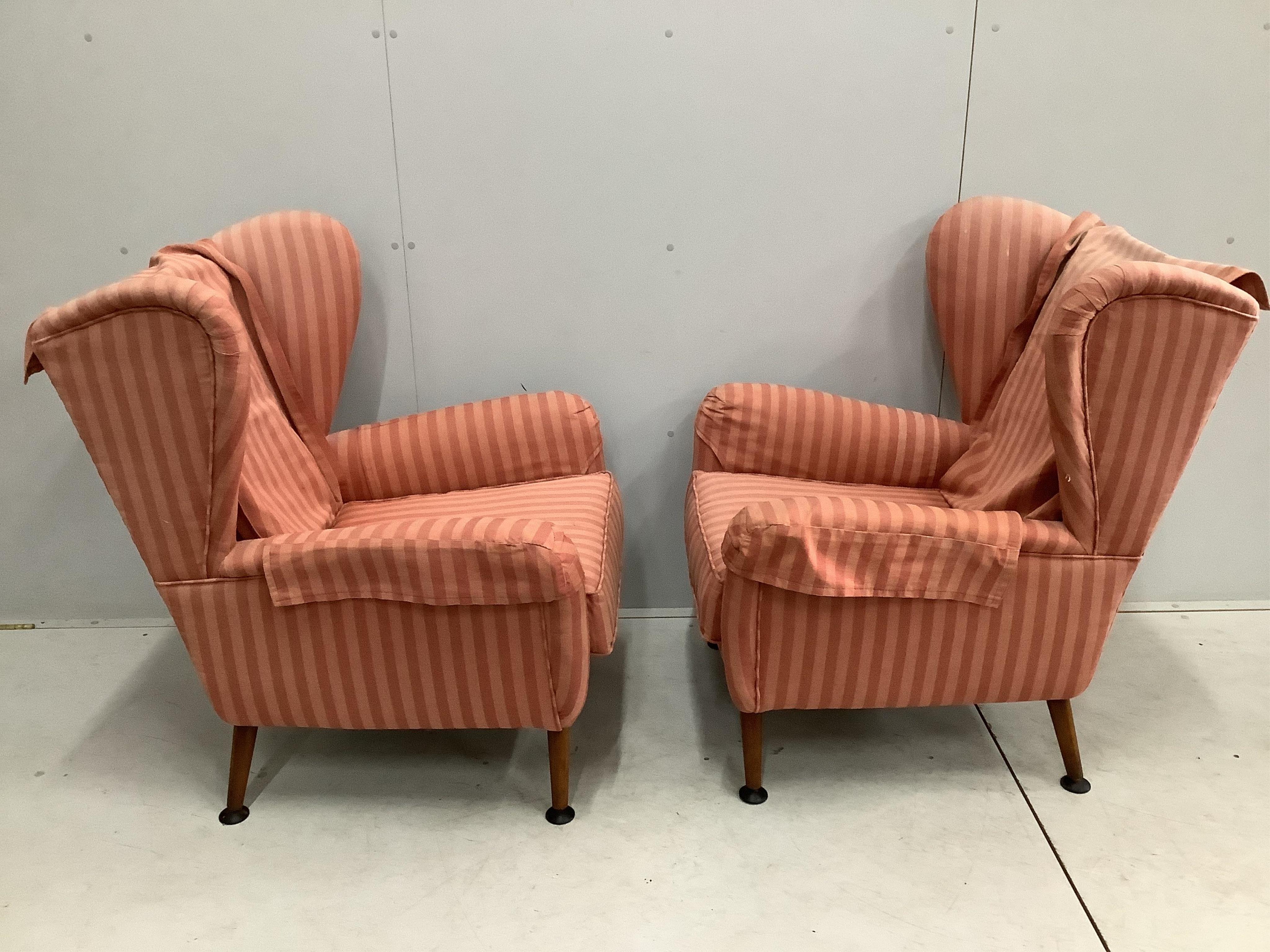 A pair of Bambino style upholstered wing armchairs, width 76cm, depth 71cm, height 99cm. Condition - fair, upholstery faded